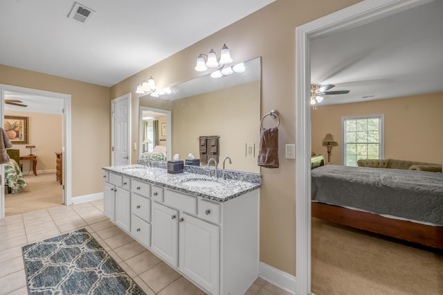 bathroom with tile patterned floors, ceiling fan, and vanity