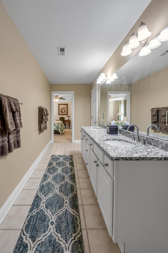 bathroom featuring tile patterned flooring, vanity, and ceiling fan