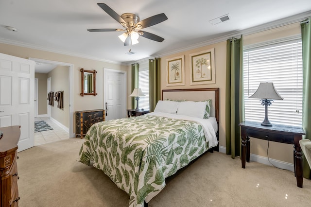 carpeted bedroom with multiple windows, ceiling fan, and ornamental molding