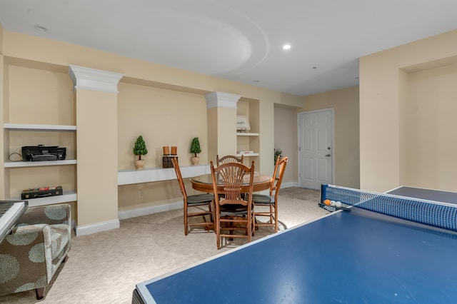 recreation room featuring built in features and carpet