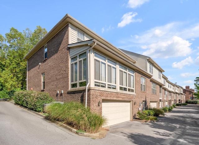 view of home's exterior featuring a garage