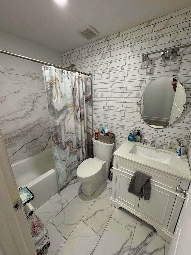 full bathroom featuring toilet, vanity, shower / tub combo with curtain, and tile walls