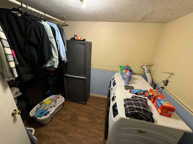 laundry area with independent washer and dryer, a textured ceiling, and dark hardwood / wood-style floors