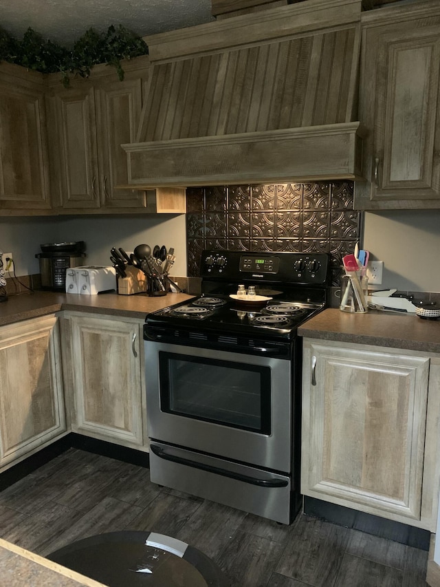 kitchen featuring stainless steel electric range, custom exhaust hood, and dark hardwood / wood-style floors