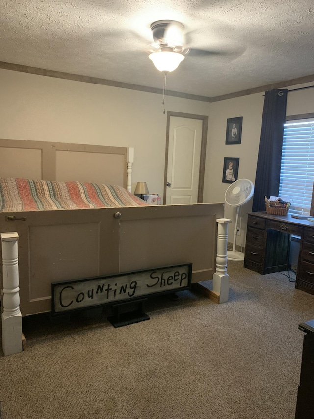 bedroom with a textured ceiling, ceiling fan, and carpet flooring