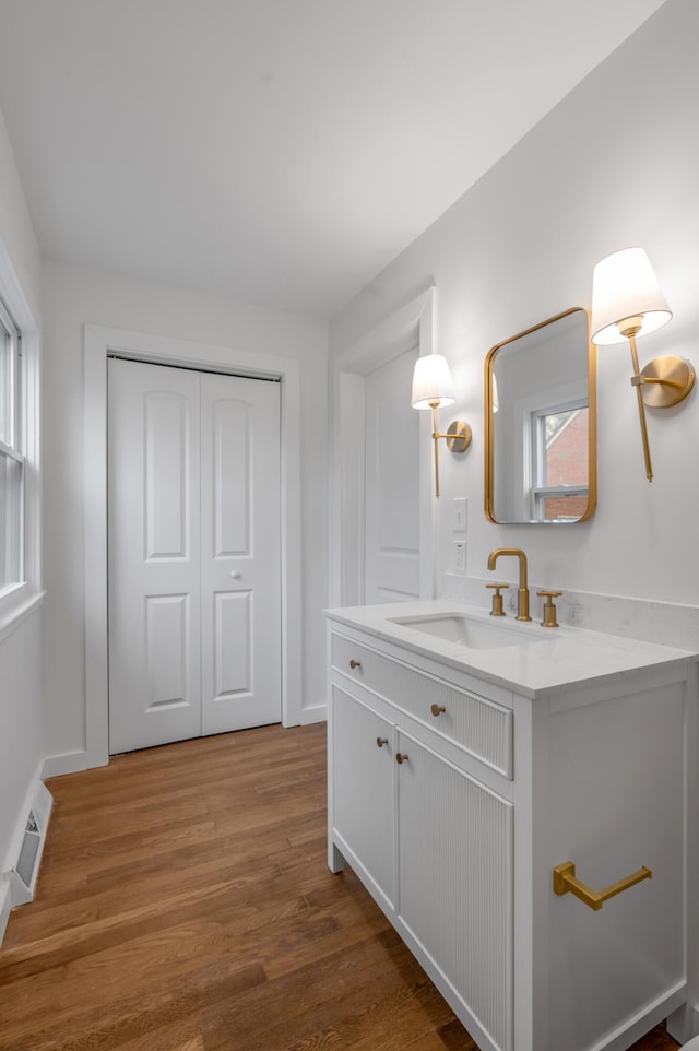 bathroom featuring vanity and hardwood / wood-style flooring