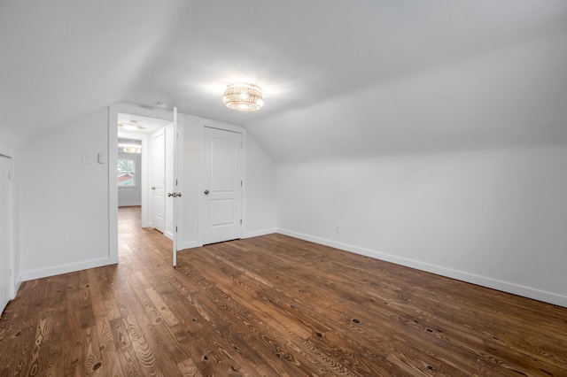 bonus room featuring lofted ceiling and hardwood / wood-style flooring