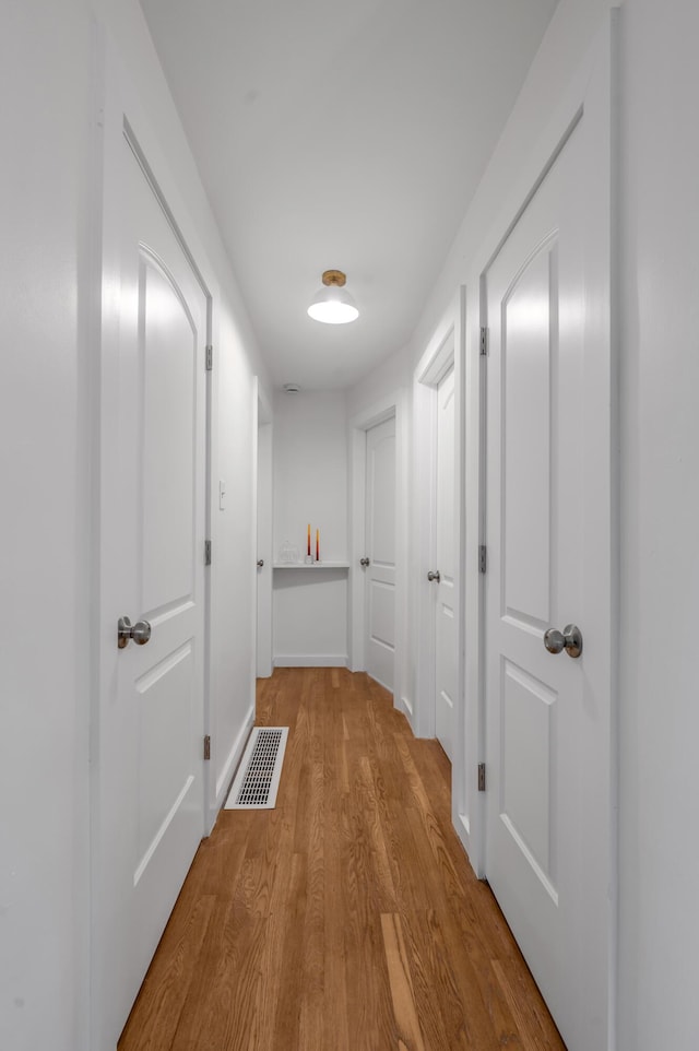 hallway featuring light wood-type flooring