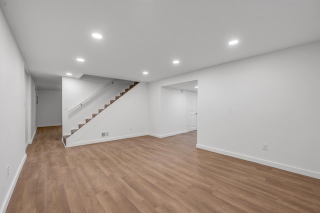 basement featuring light wood-type flooring