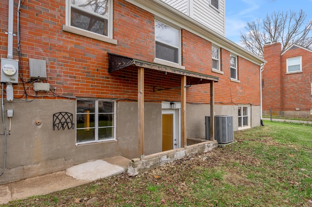 rear view of house with central AC