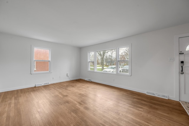 spare room with light wood-type flooring