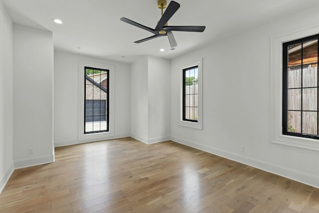 unfurnished room featuring ceiling fan and light hardwood / wood-style floors