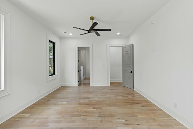 unfurnished bedroom featuring ceiling fan and light hardwood / wood-style floors