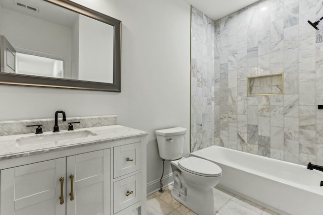 full bathroom with toilet, vanity, and tiled shower / bath combo