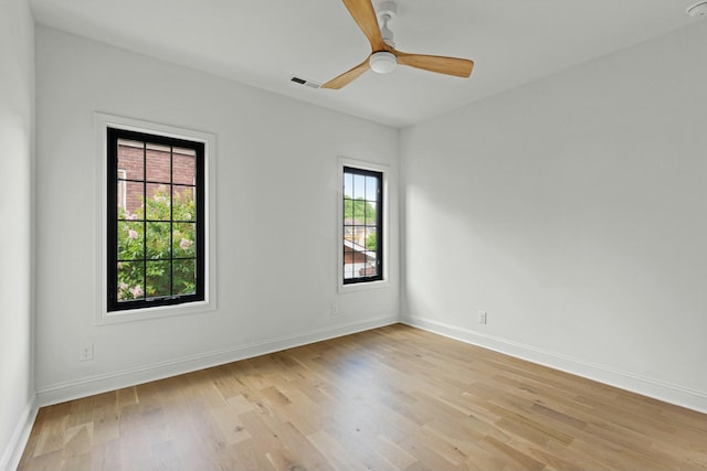 spare room with ceiling fan and light hardwood / wood-style flooring