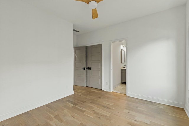 empty room featuring light hardwood / wood-style flooring and ceiling fan