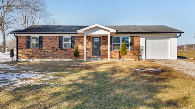 single story home featuring a front yard and a garage