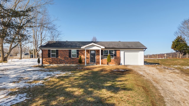 ranch-style house with a lawn and a garage