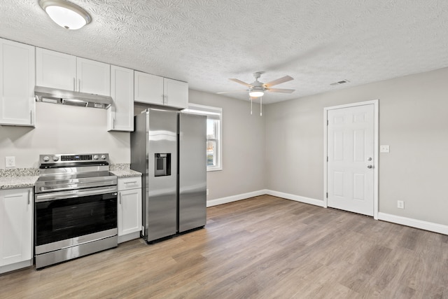 kitchen with white cabinets, stainless steel appliances, and ceiling fan