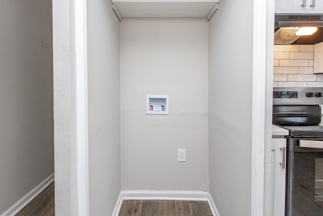 laundry area with hookup for a washing machine and dark hardwood / wood-style flooring