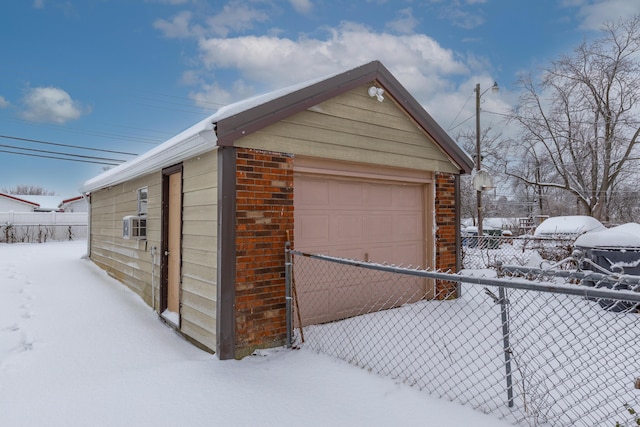 view of snow covered garage