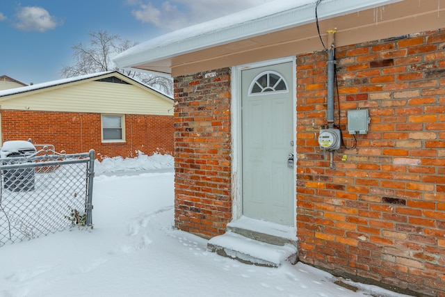 view of snow covered property entrance