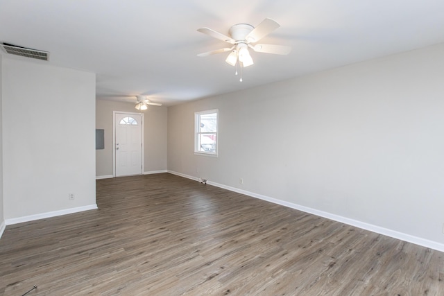 unfurnished room with ceiling fan and dark hardwood / wood-style flooring