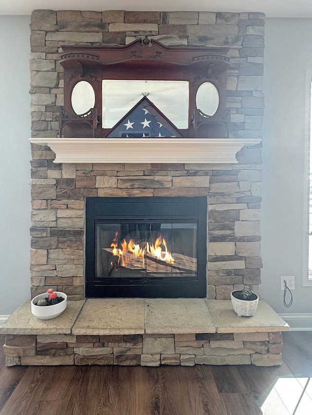 interior details with hardwood / wood-style flooring and a fireplace