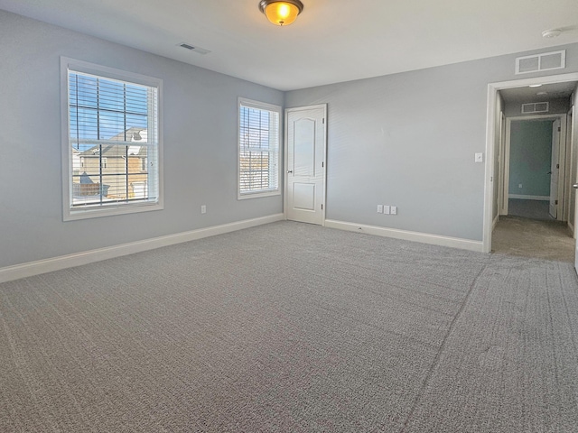 empty room featuring carpet flooring