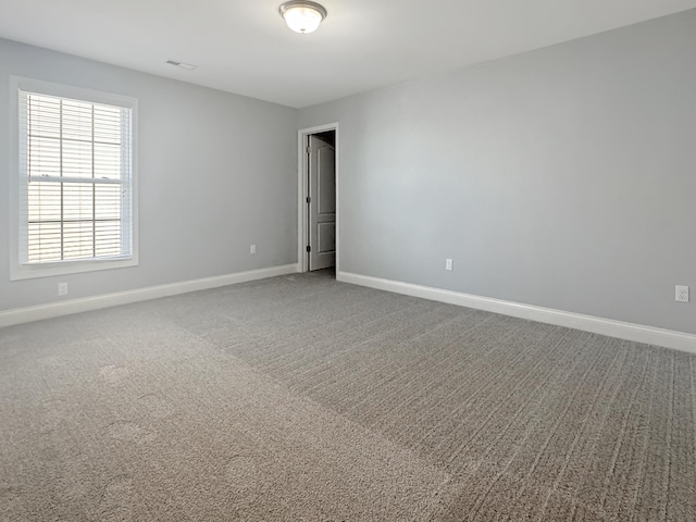 spare room with carpet floors