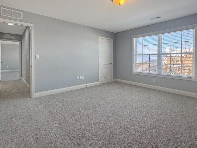 unfurnished room featuring carpet flooring