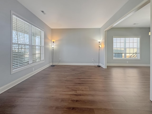 spare room with dark hardwood / wood-style flooring