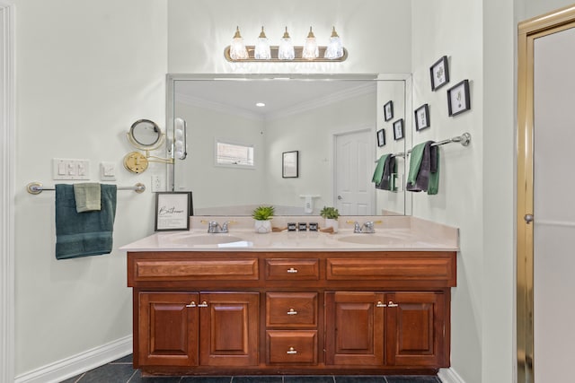 bathroom with ornamental molding and vanity