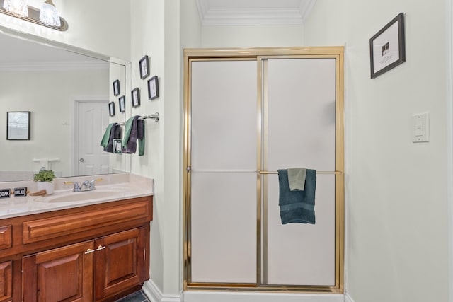 bathroom with vanity, ornamental molding, and walk in shower