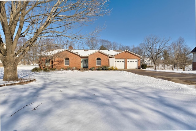 single story home with a garage