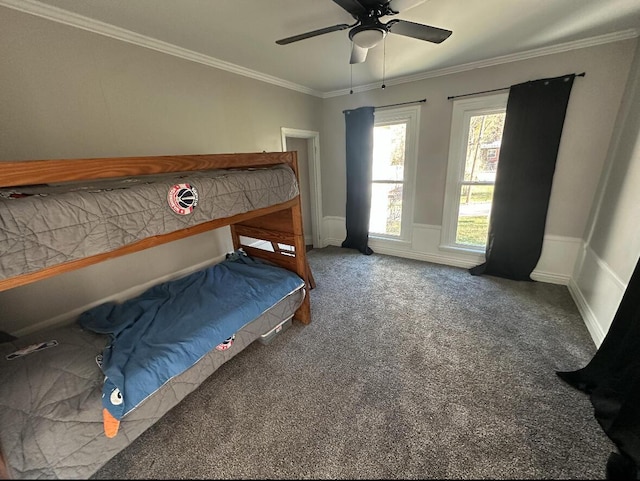 unfurnished bedroom featuring carpet floors, ornamental molding, and ceiling fan