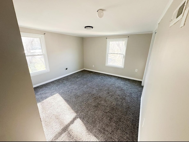 empty room with dark carpet