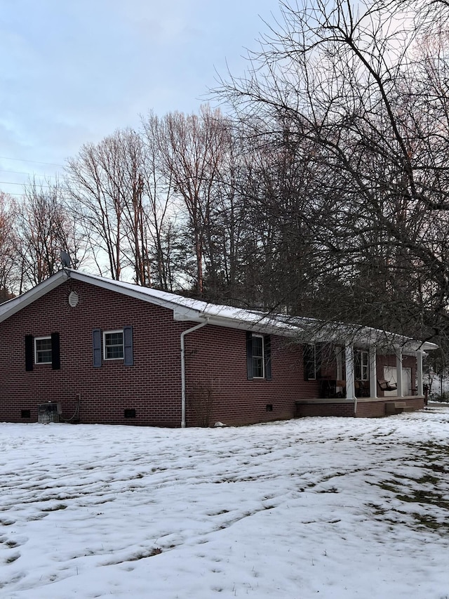 view of snow covered house