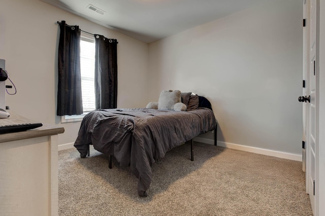 bedroom with light carpet