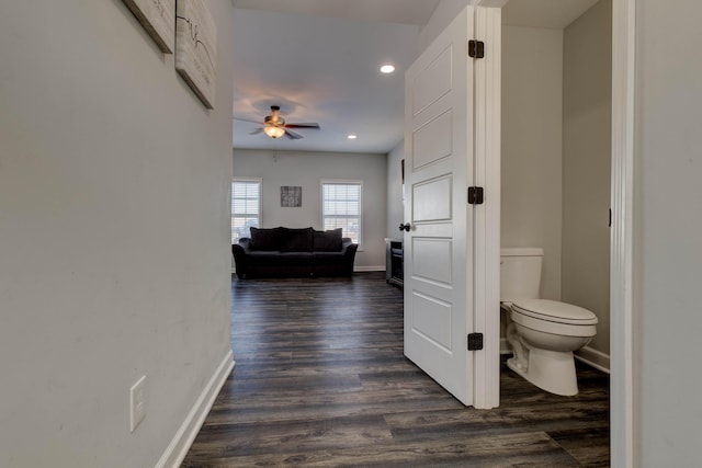 corridor featuring dark hardwood / wood-style floors