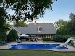 view of pool with a gazebo, a patio, and a water slide