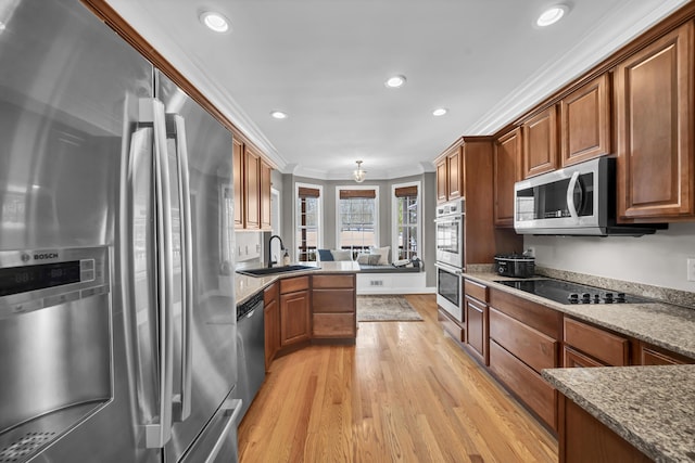 kitchen featuring stone counters, sink, stainless steel appliances, light hardwood / wood-style flooring, and crown molding