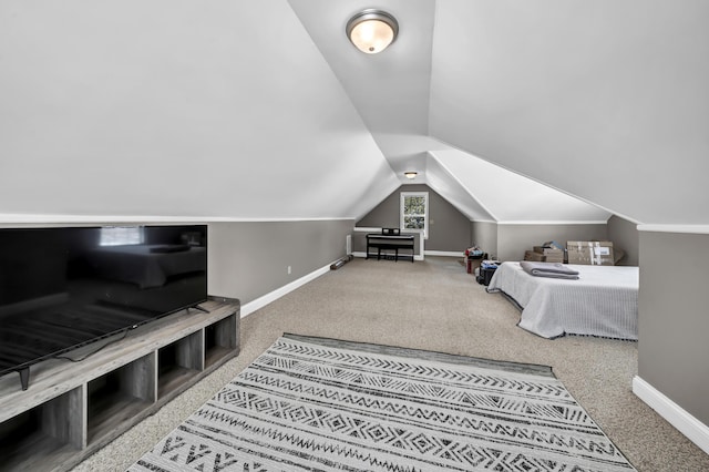 carpeted bedroom with vaulted ceiling