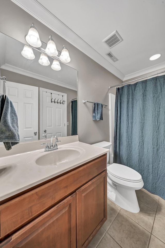 bathroom featuring tile patterned flooring, vanity, toilet, and crown molding