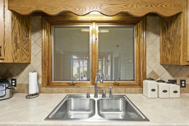 kitchen with decorative backsplash and sink