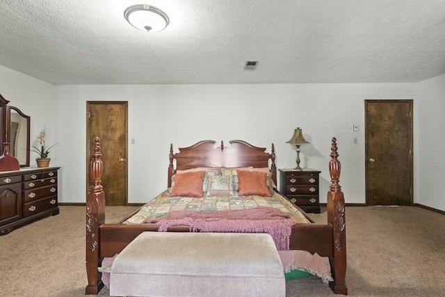 carpeted bedroom with a textured ceiling