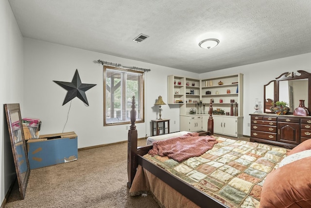 bedroom featuring carpet and a textured ceiling