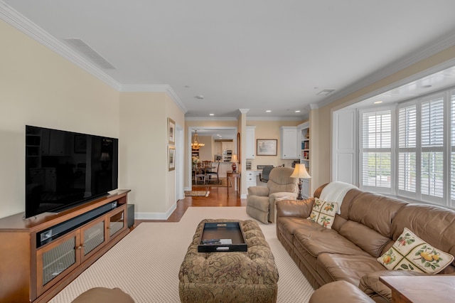 living room featuring light hardwood / wood-style floors and ornamental molding