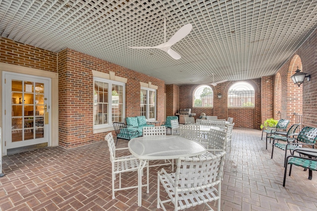 view of patio featuring ceiling fan