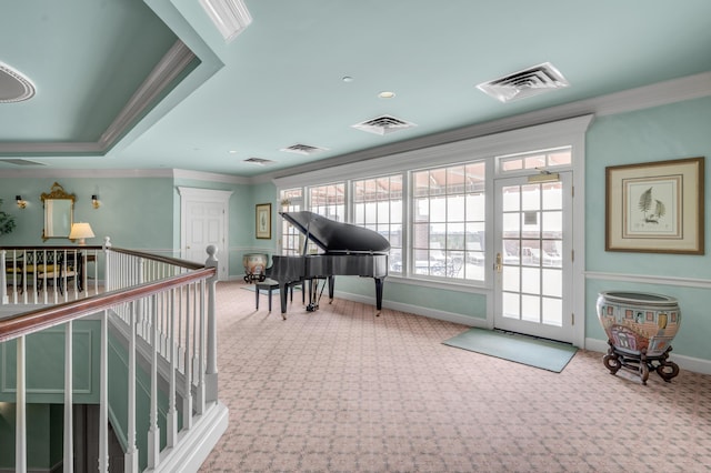 misc room featuring ornamental molding and light carpet